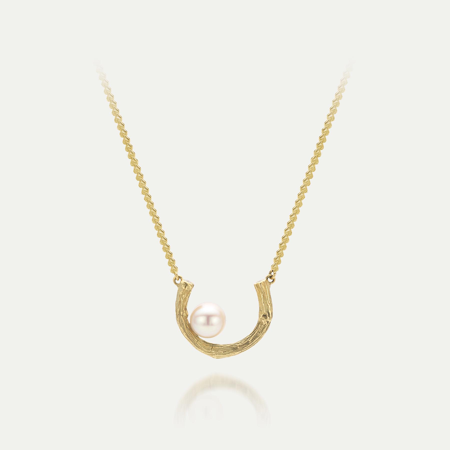 Geelgouden collier met hoefijzer en parel